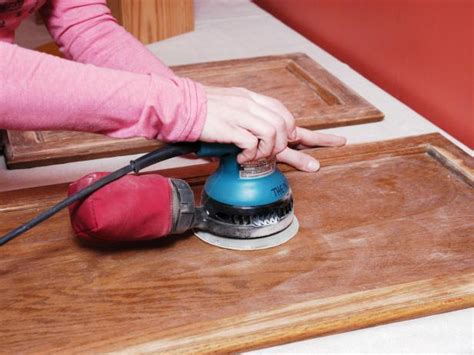 sanding wood cabinet with steel wool before poly|sand coating for woodworking.